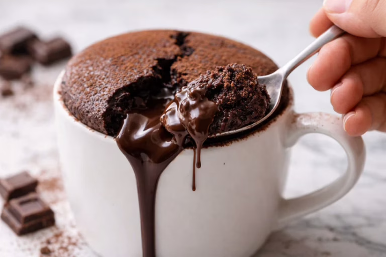 The cake rises perfectly with molten chocolate ready to flow.