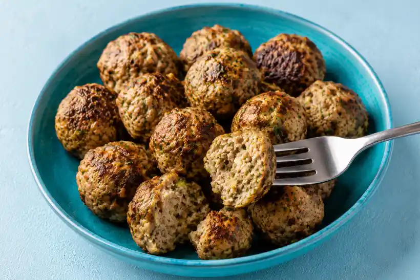 Juicy bariatric chicken meatball cut open on a fork